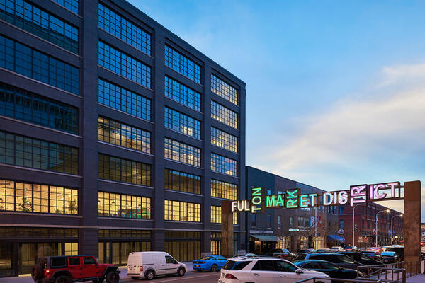 High End Office Construction Chicago - 811 W Fulton exterior view at night with Fulton Market sign